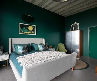 green bedroom with metallic wardrobe