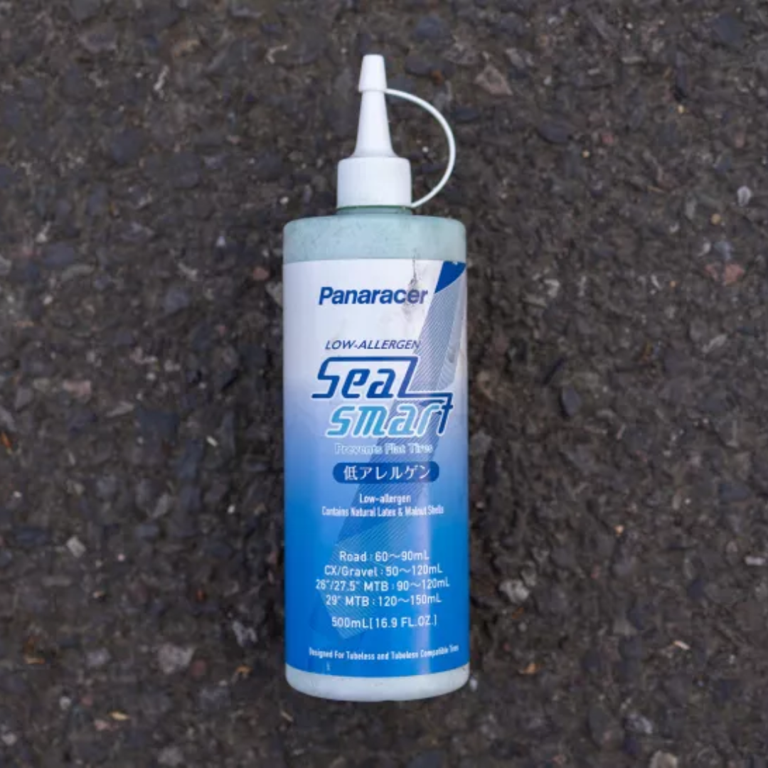 A bottle of Panaracer Seal Smart on a concrete background