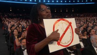 Doris Bowman holding up clock sign at 2023 Emmys
