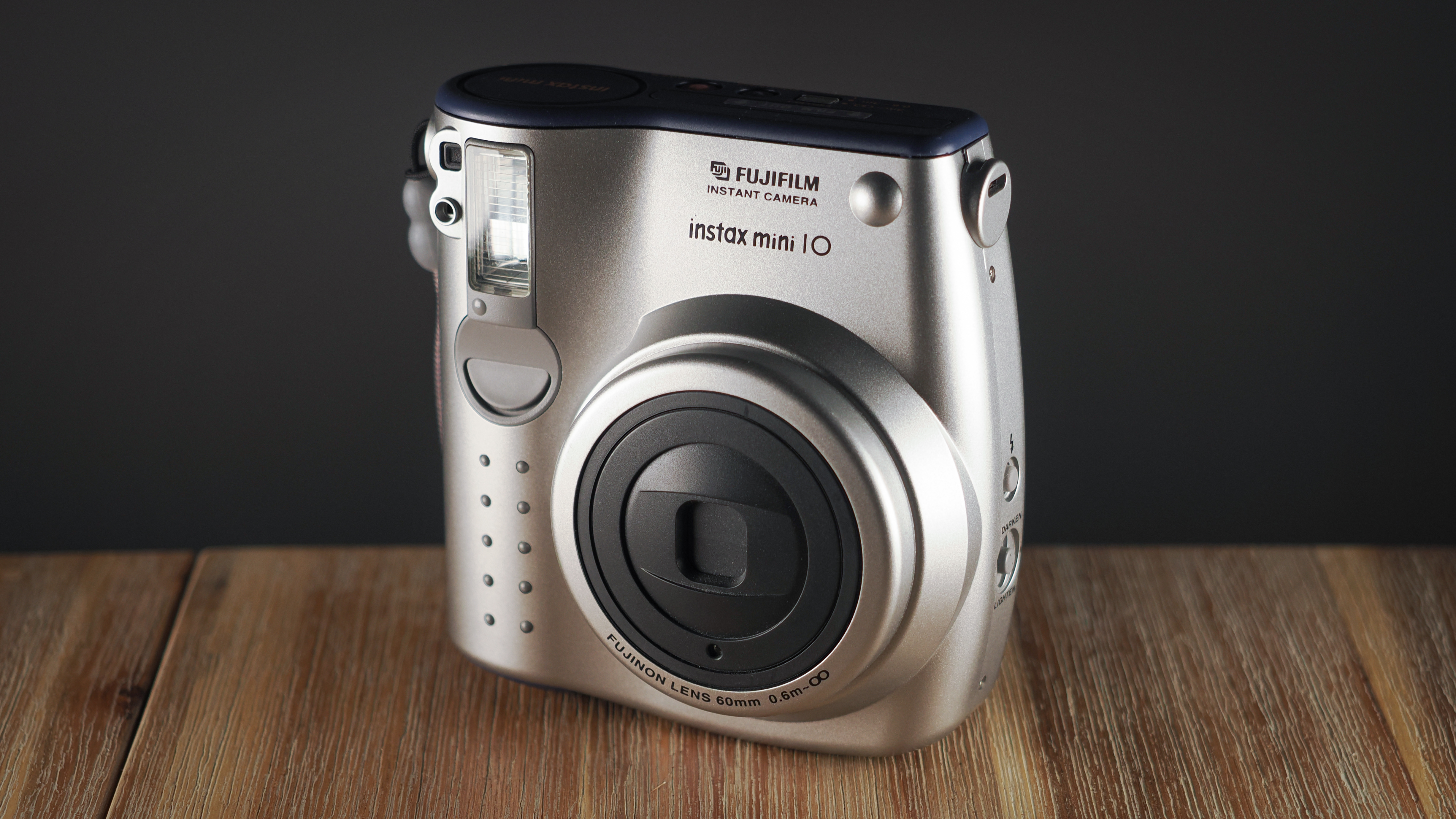 Instax Mini 10 on a wooden surface