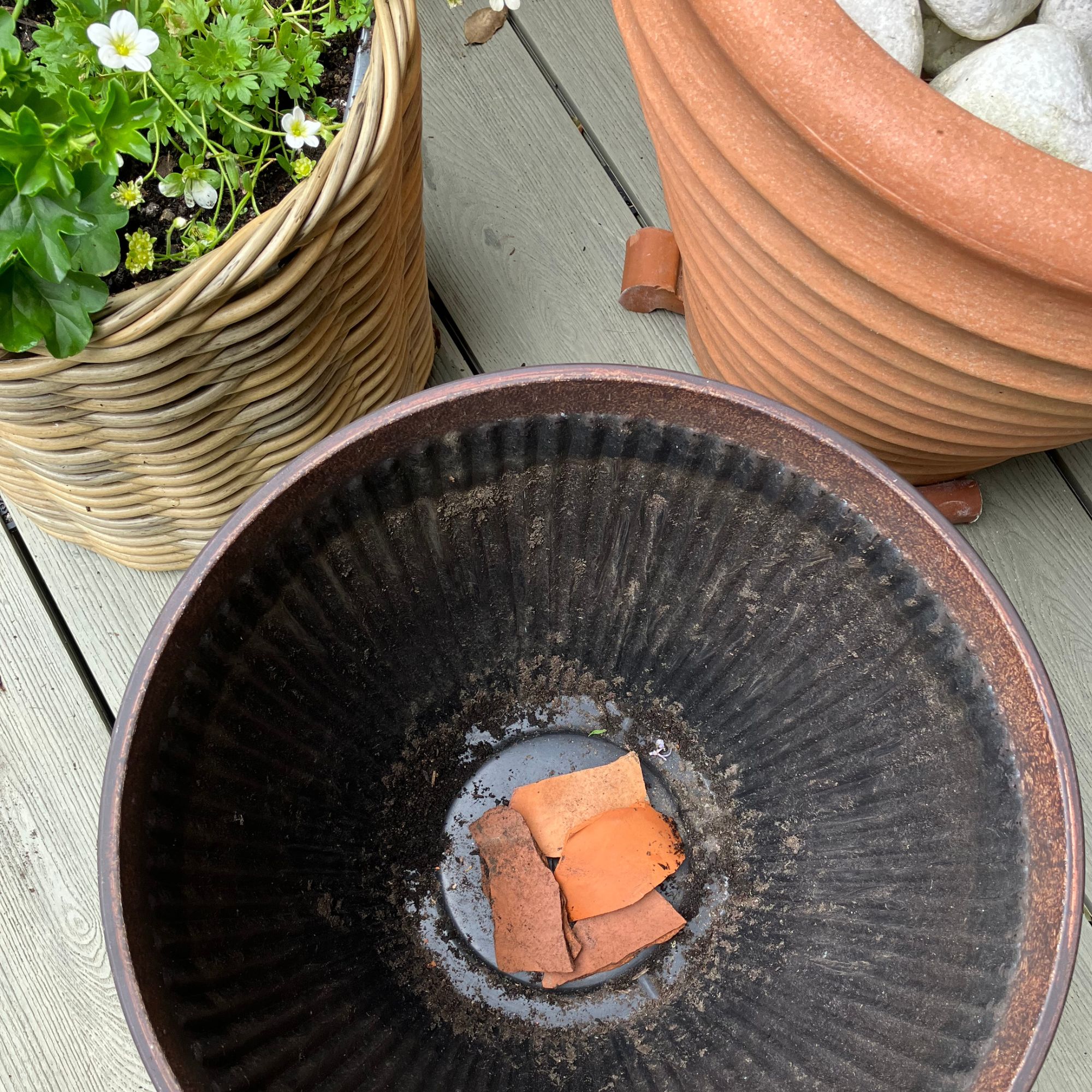 broken crockery drainage in garden planter