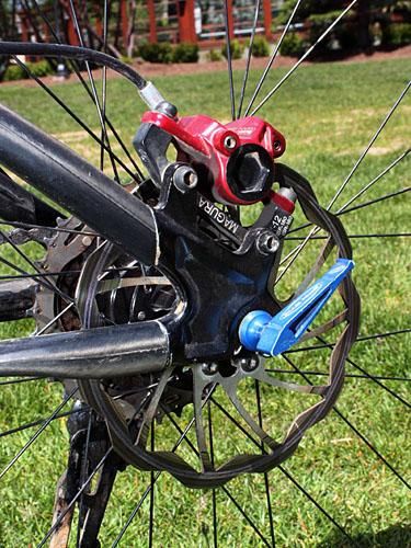 The rear wheel is affixed to the frame with an ultralight USE SpinStix skewer.