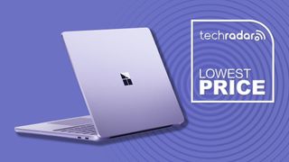 A Microsoft Surface Laptop against a violet TechRadar background 