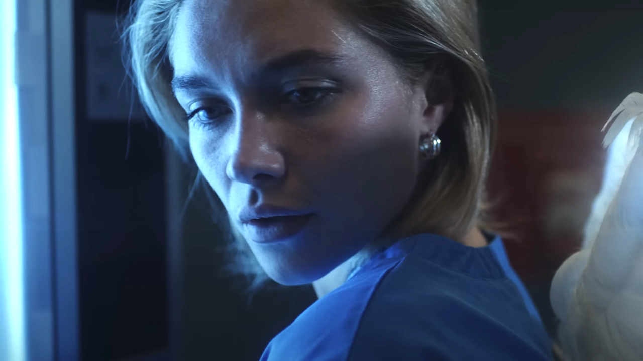 Florence Pugh looking at wings as nurse in Youngblud music video Zombie
