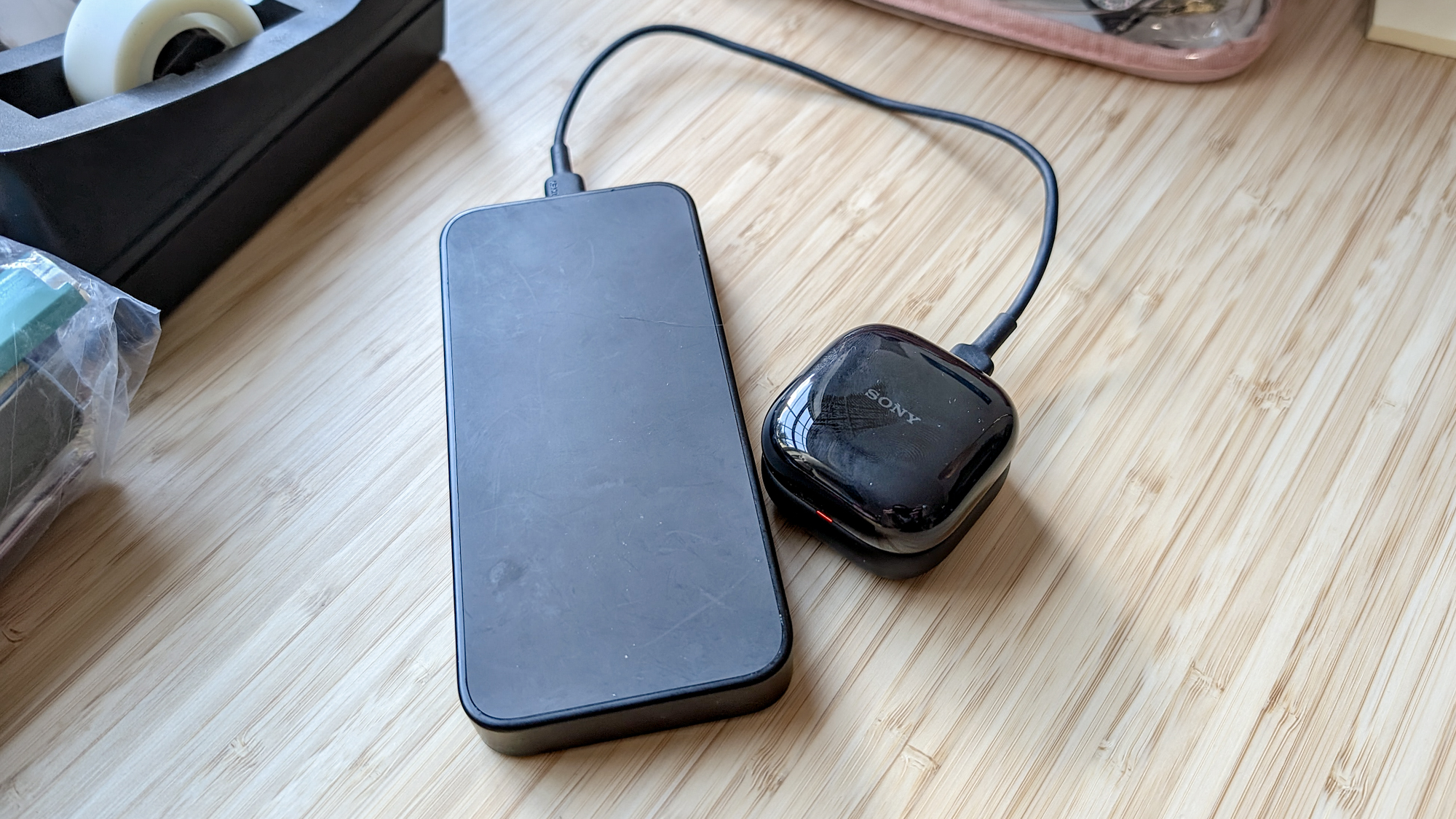 The Sony LinkBuds Clip in a Tom's Guide reviewer's hands and ears.