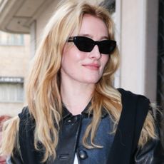 Sarah Pidgeon arrived at Milan Fashion Week wearing black cigarette jeans, a leather jacket, and a sweater on top