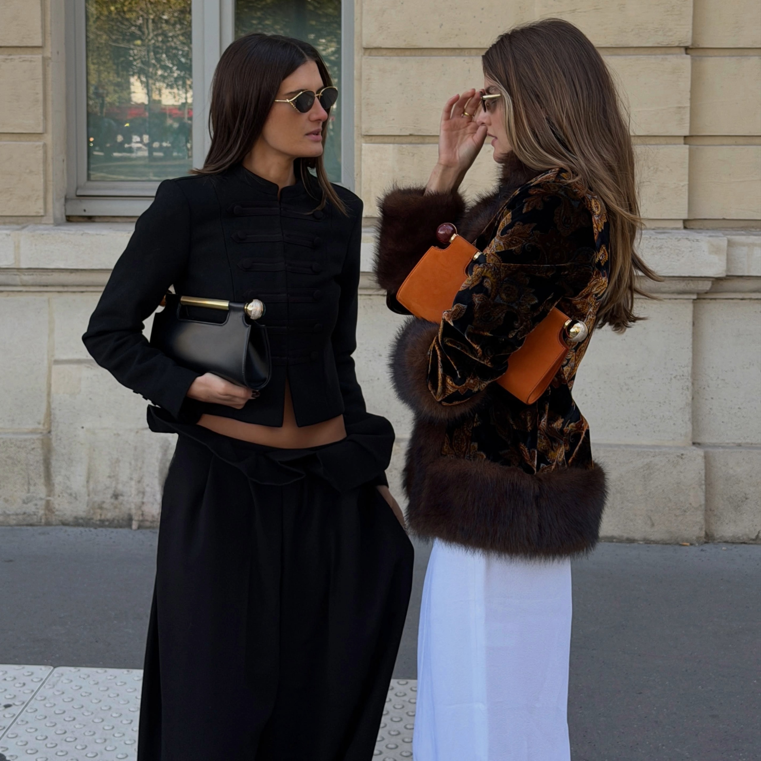 Coco Schiffer and Sara Walker in Bvlgari clutches