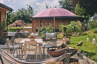 gravel patio with furniture beside lawn