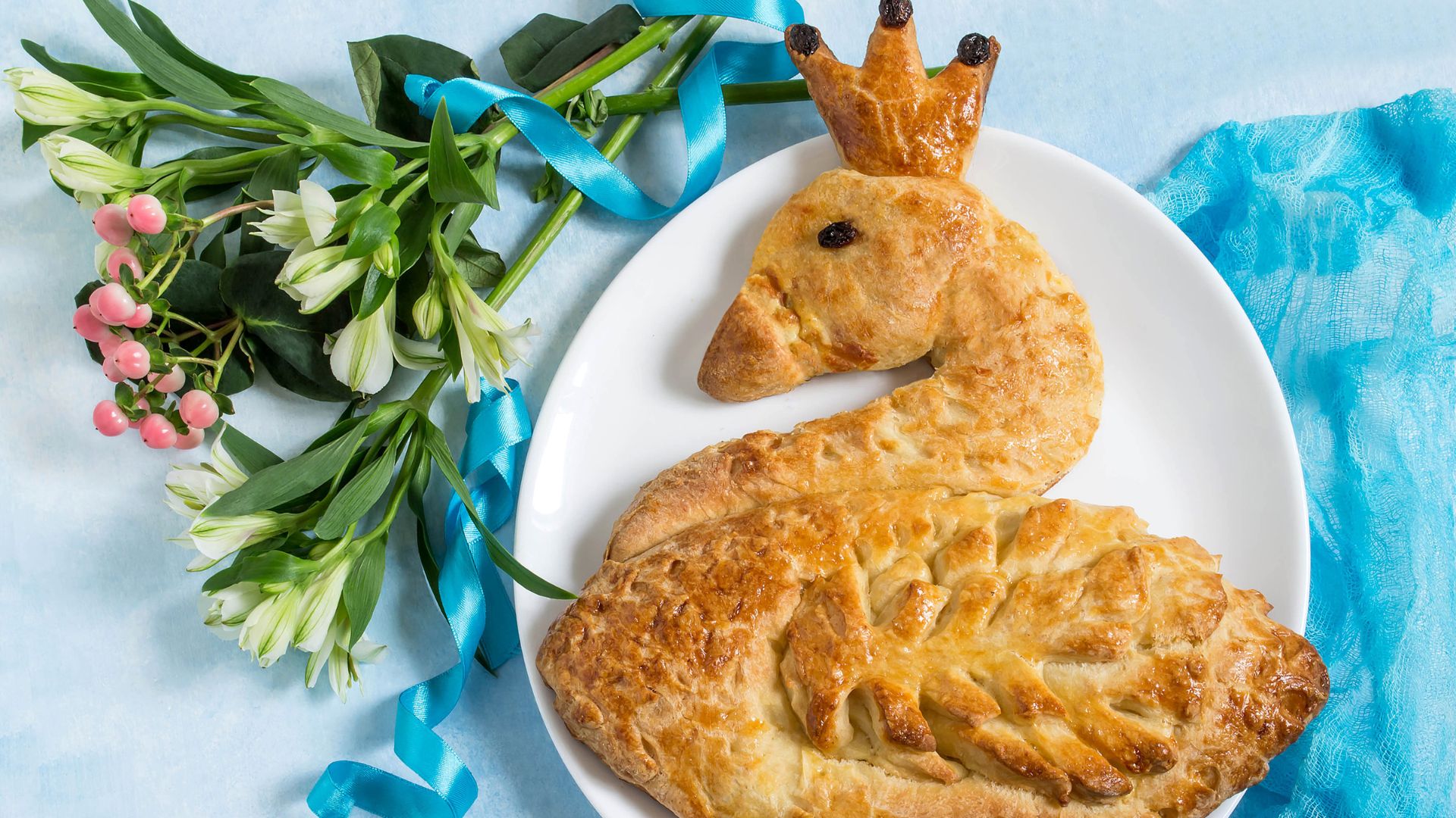 A pastry shaped and decorated like a swan