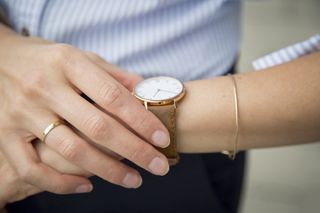 Warped sense of time: A woman looks at her watch