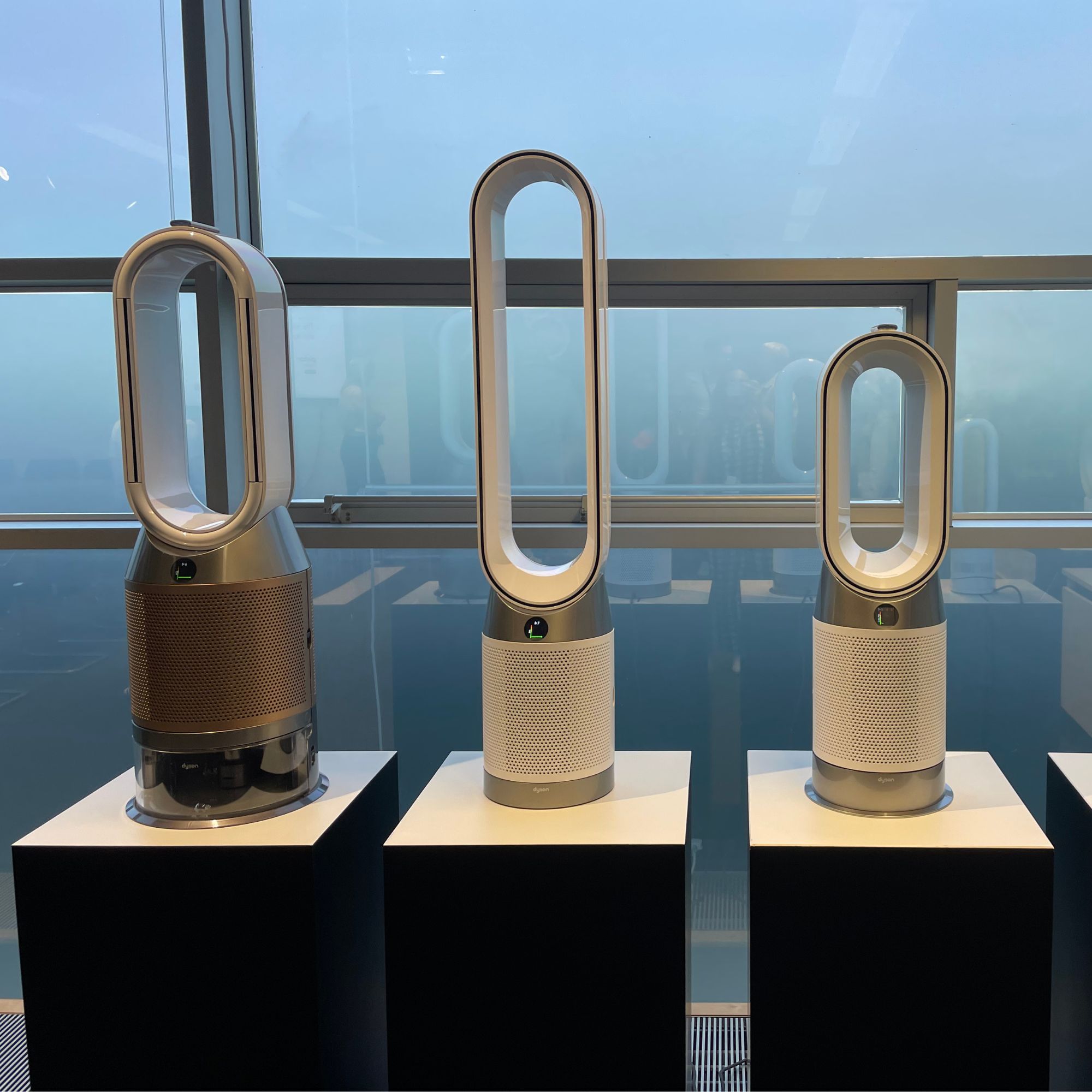Dyson Purifier Humidify+Cool PH2 De-NOx next to other dyson fans on plinths