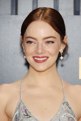 Emma Stone is pictured with a glossy updo hairstyle whilst attending the 30th Annual Screen Actors Guild Awards at Shrine Auditorium and Expo Hall on February 24, 2024 in Los Angeles, California.