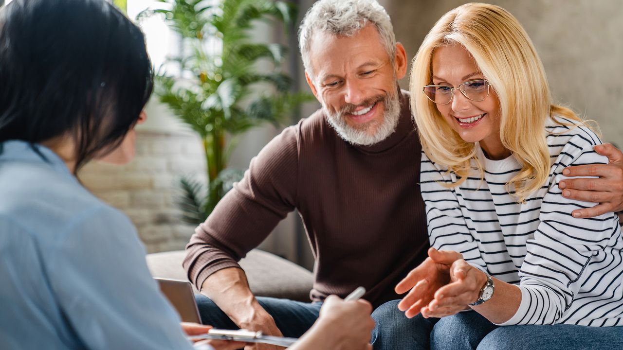 Older couple meeting with a financial adviser