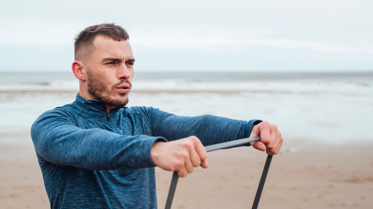 Man doing resistance band workout