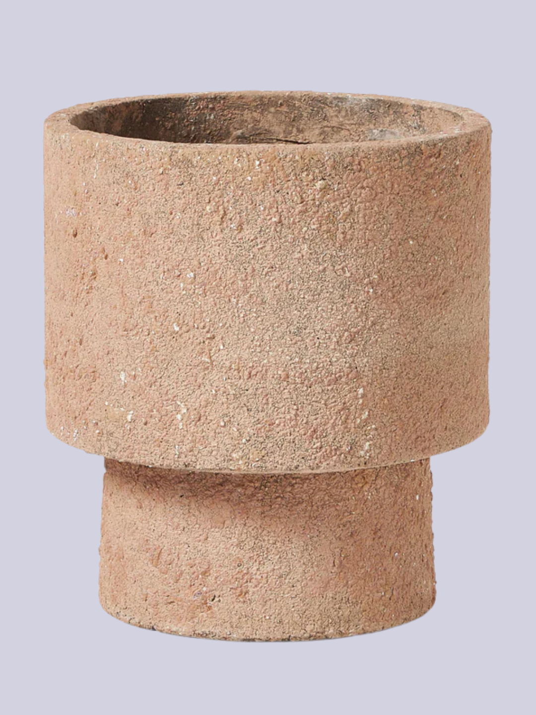 A sandy outdoor pot