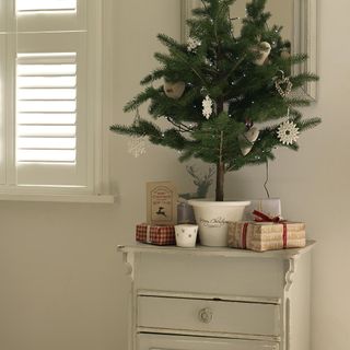 white wall room christmas tree on white drawer