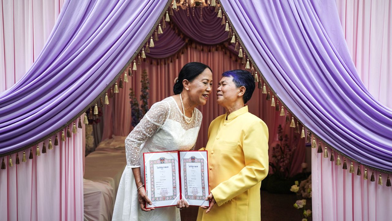 Same-sex couple shows of marriage certificate as Thailand enacts marriage equality