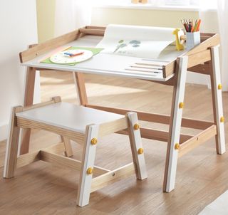 kids room with wooden flooring and practical desk and bench set