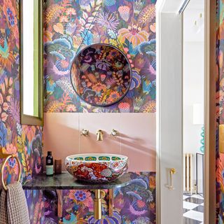 Multicoloured floral wallpaper in downstairs loo