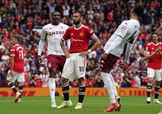 Bruno Fernandes (centre) reacts after missing a late penalty against Aston Villa