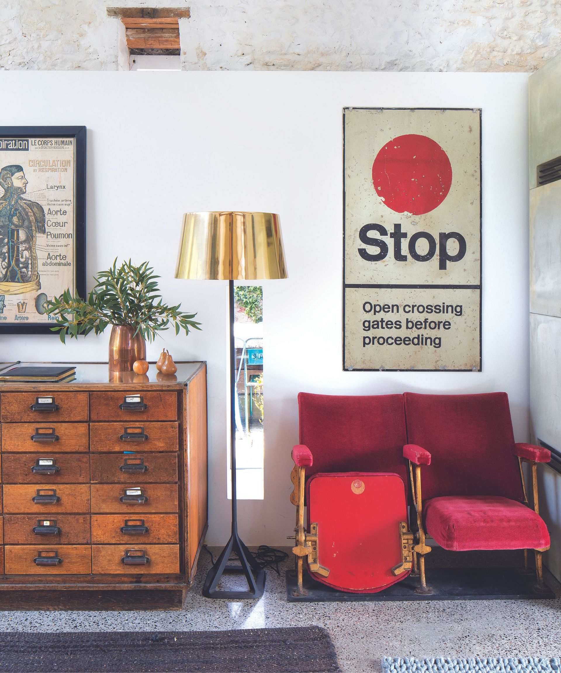 Red cinema chairs, wooden cabinet, gold lampshade