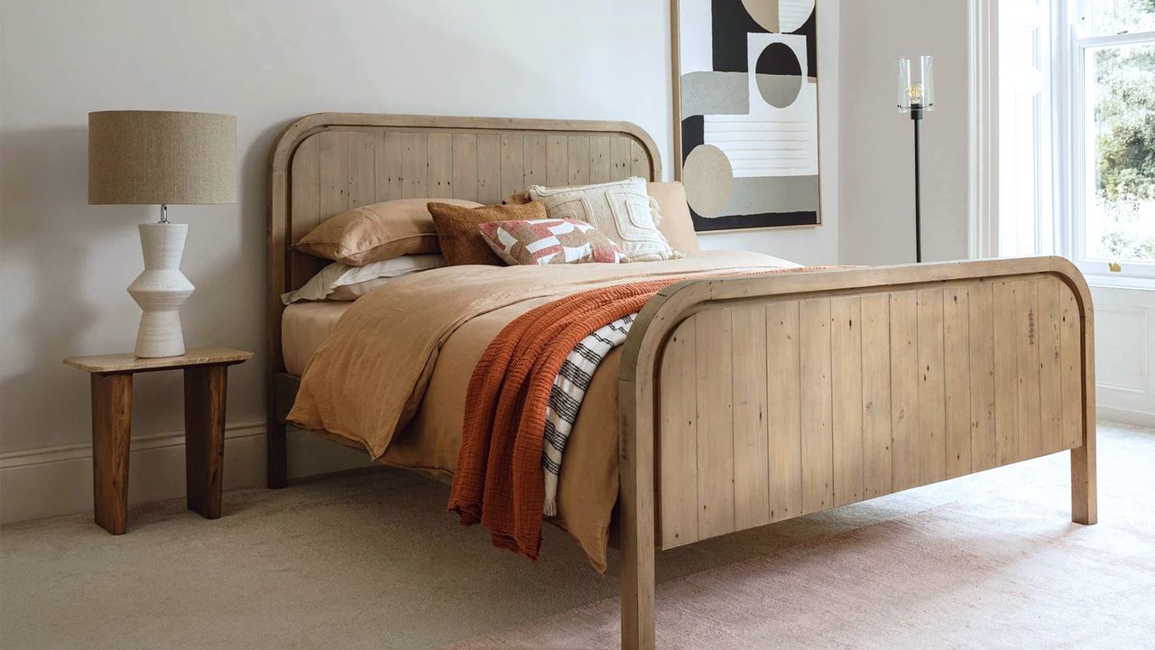 Wooden bed in a neutral bedroom