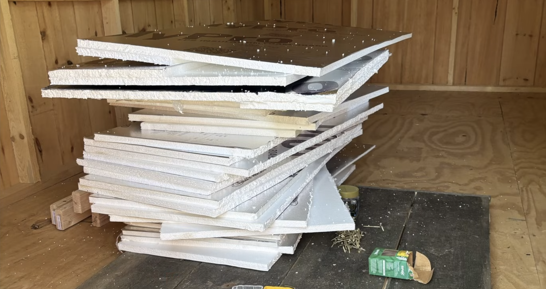 Shed cleanroom - a pile of insulation inside a wood shed