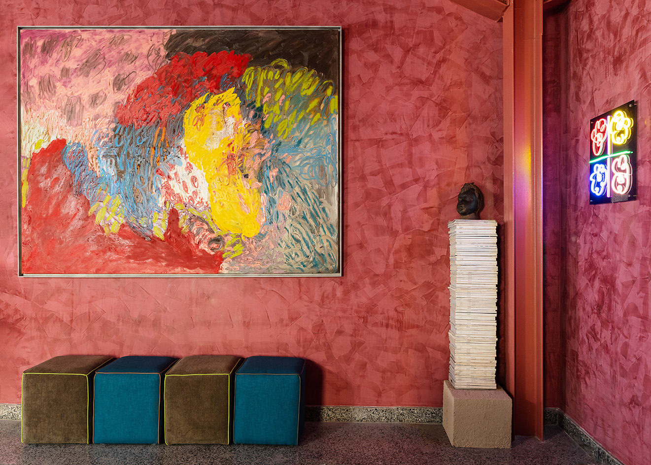interiors at Mbari Kola, with design led furniture and art seen on walls