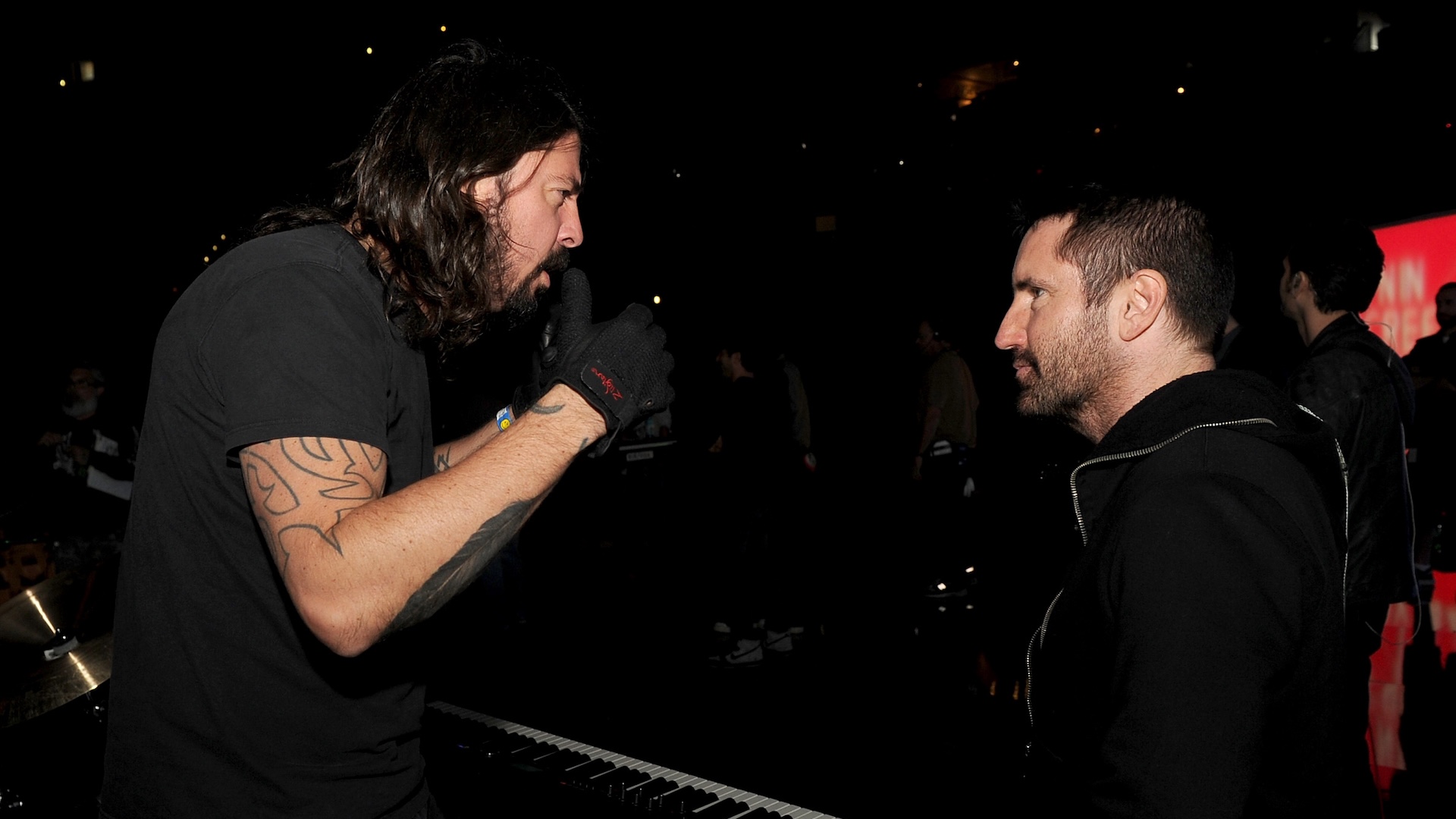 Grohl and Reznor speak backstage during the 56th GRAMMY Awards at Staples Center on January 24, 2014 in Los Angeles.