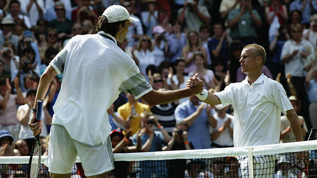 Two tennis players shaking hands