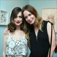 Anne Hathaway (L) and actress Emily Blunt attend Disney's Alice Through the Looking Glass event on May 12, 2016 at Roseark in Los Angeles California