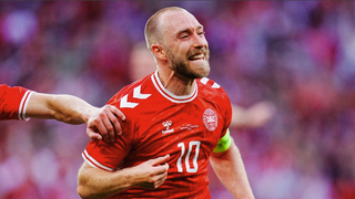 Denmark's midfielder Christian Eriksen celebrates ahead of the Slovenia vs Denmark Group C match.