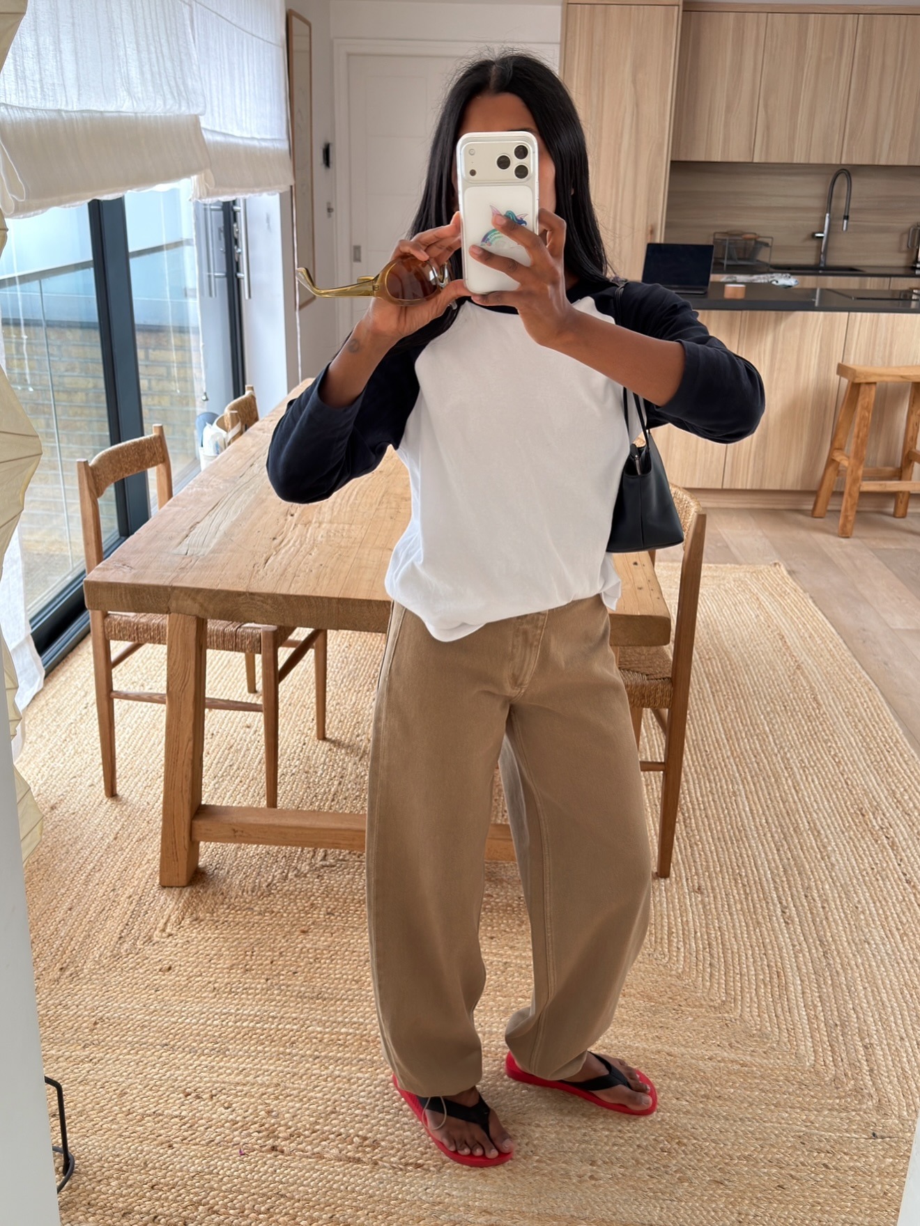 Woman wearing barrel leg jeans.