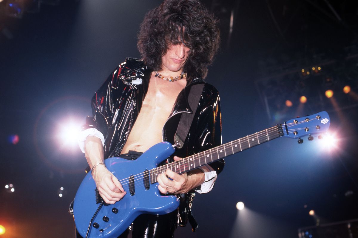 Joe Perry performs onstage with Aerosmith at the Joe Louis Arena in Detroit, Michigan on December 5, 1987