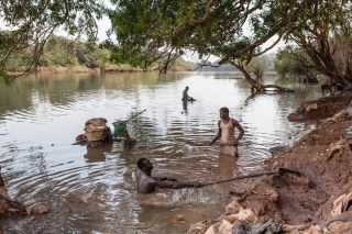 Gold mining along the River Gambia as it flows through Southern Senegal draws economic migrants from all over West Africa. The gold bearing sand is filtered and then mixed with mercury to draw the gold out