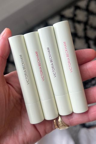 Katie holding all four Posh Balms