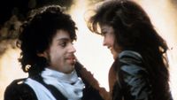 Prince embraces Apollonia Kotero in a scene from the film 'Purple Rain', 1984. (Photo by Warner Brothers/Getty Images)