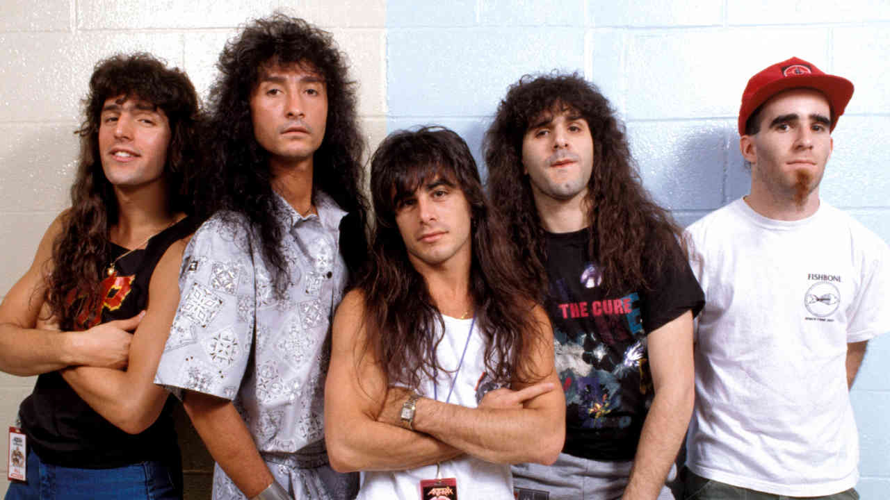 Anthrax posing for a photograph against a white wall in 1987