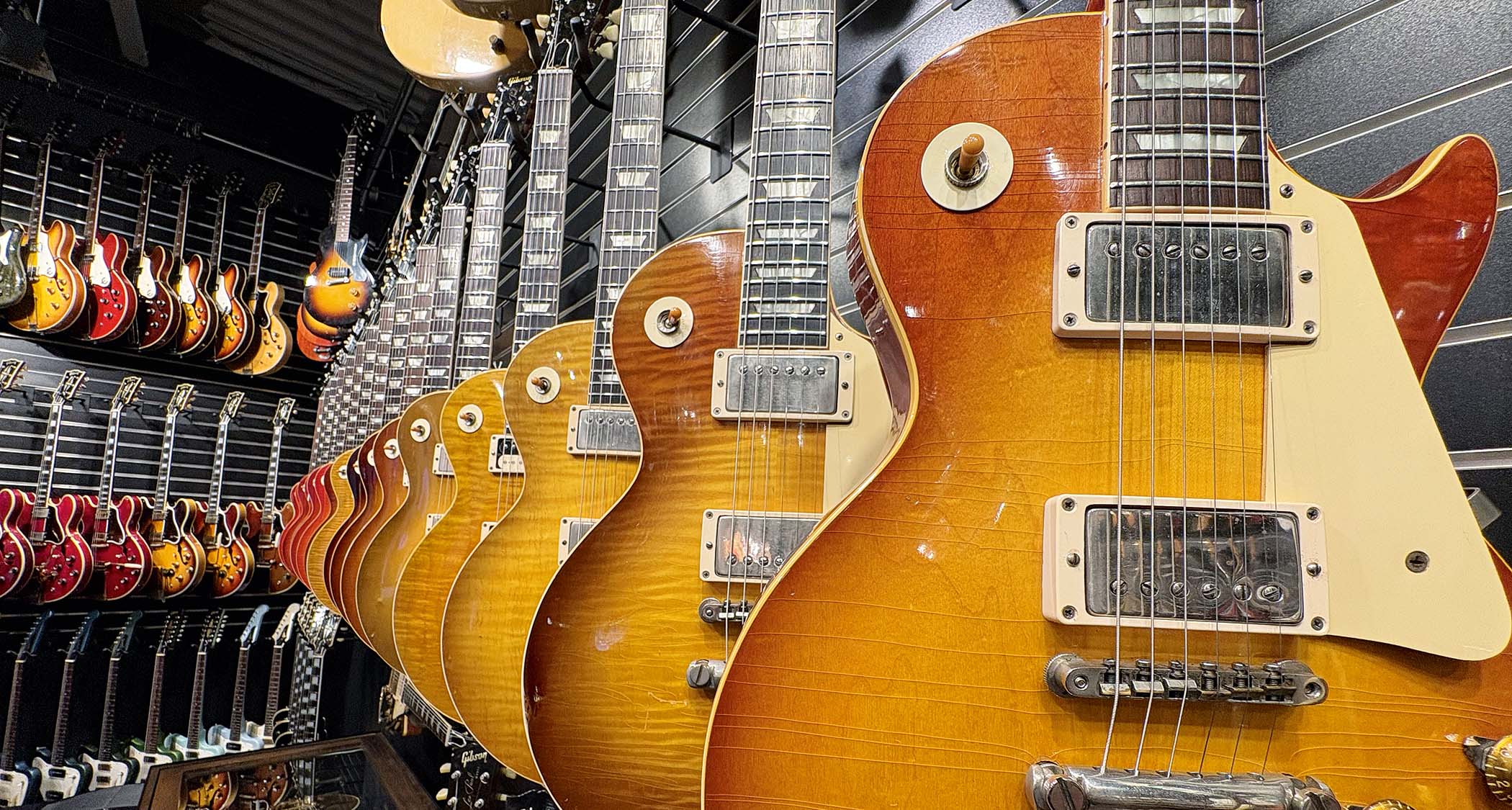 The view from the shop floor at Well Strung Guitars, where the walls are stacked with vintage guitars from Fender, Gibson and more