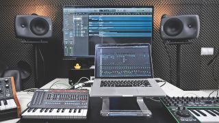 A studio setup with a MacBook at the centre