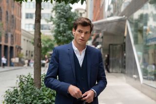 Ashton Kutcher as Peter wearing a suit