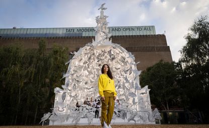 Es Devlin stands in front of Come Home Again, commissioned by Cartier and installed in front of Tate Modern