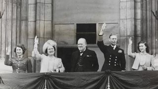 Winston Churchill joins King George VI, Queen Elizabeth, Princess Elizabeth and Princess Margaret to celebrate VE Day, 1945