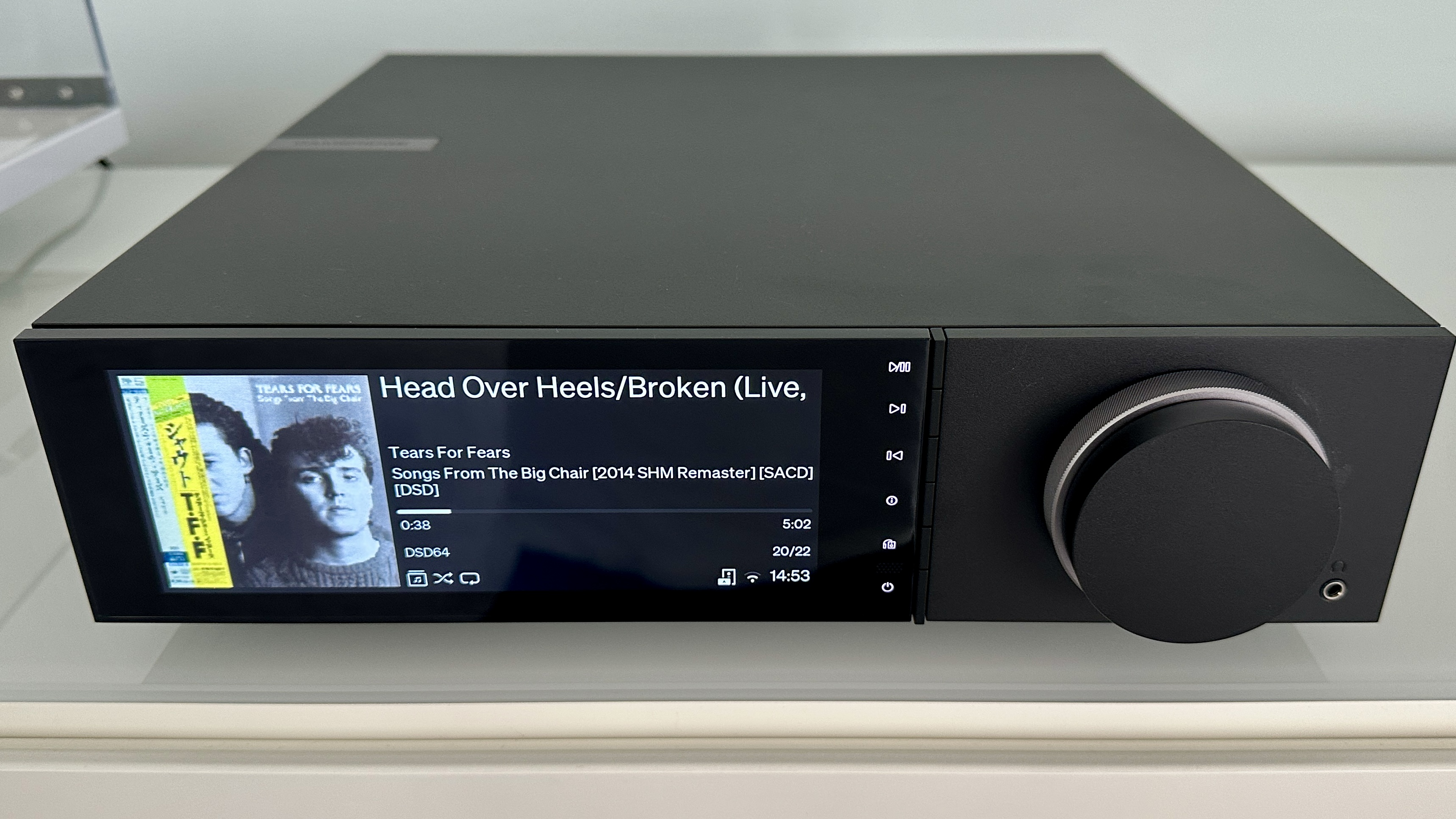 The Cambridge Evo 150 SE on a gray hi-fi rack, showing the color screen, grilles and ports