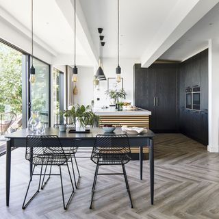 white kitchen with textured tiled flooring and white worktop