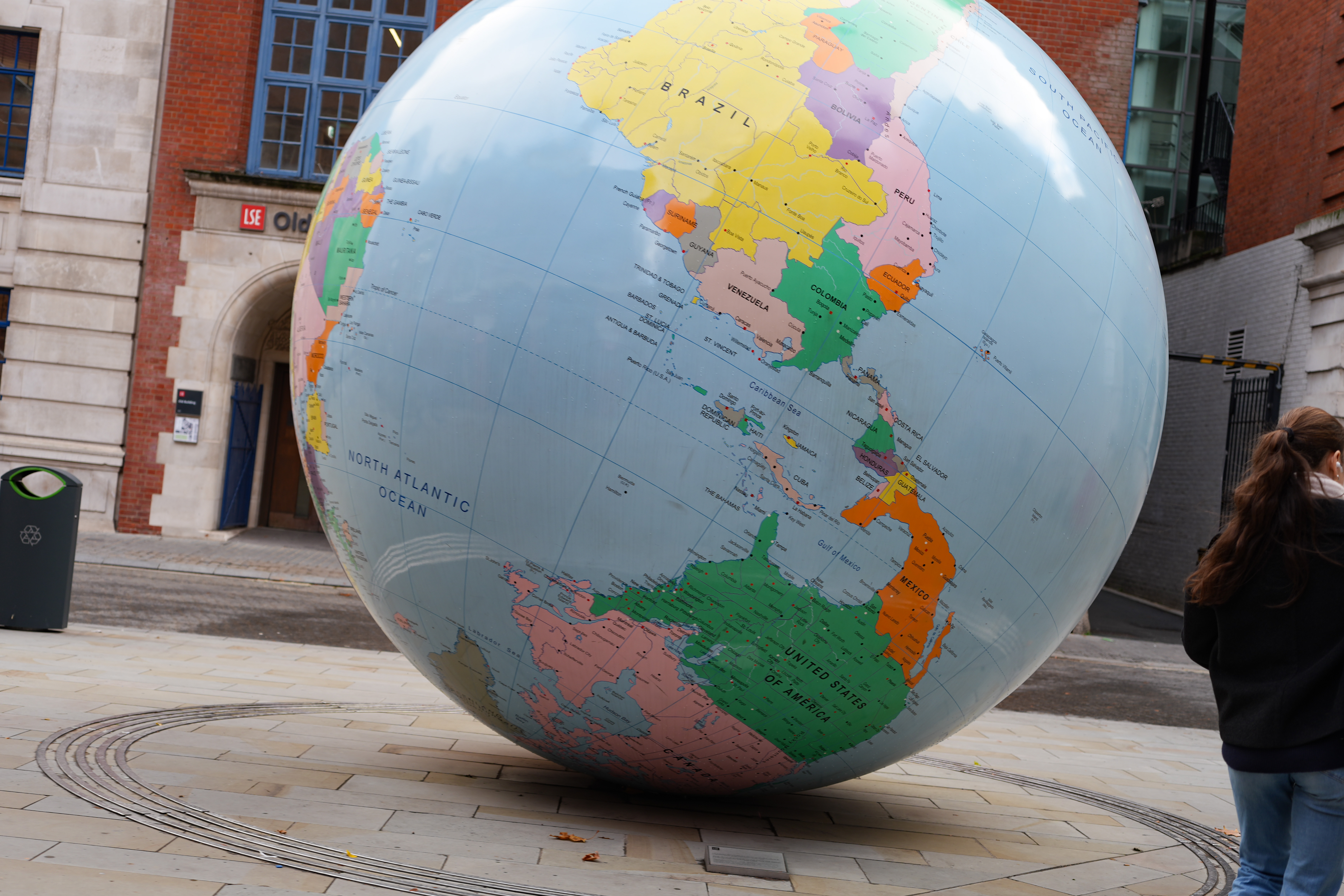 A large globe of the World outside in the street
