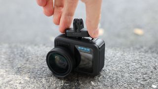 GoPro HERO13 Black action camera held in a hand