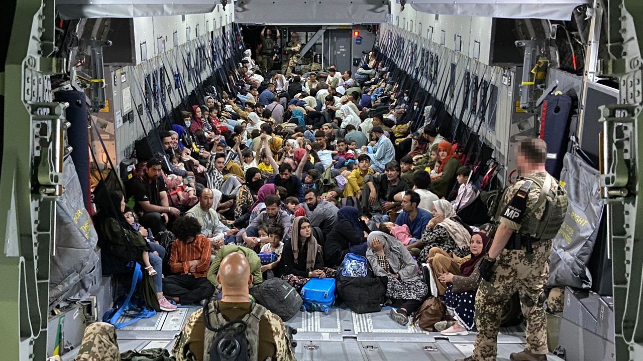 German soldiers waiting to evacuate a group of Afghan civilians