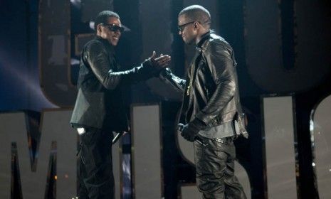 Chart-toping hip-hop artists Jay-Z (left) and Kanye West