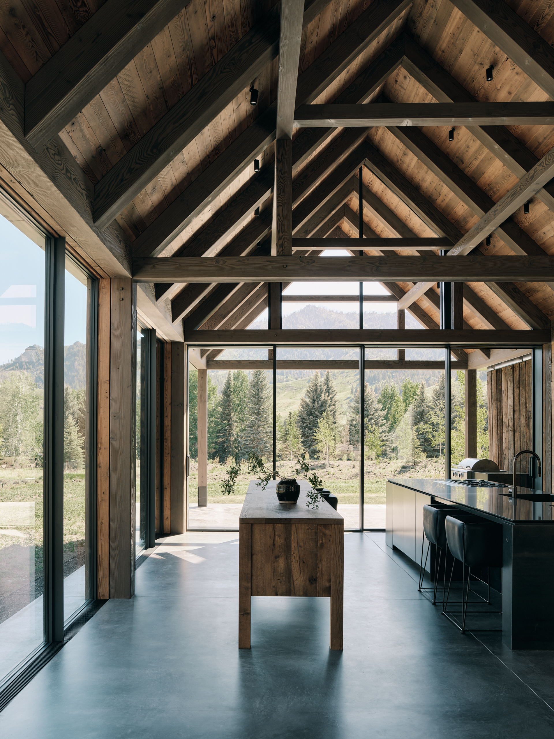 Three Barns by Field Architecture, a rural american home designed to look like a collection of old wooden barns